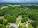 Expansive aerial view of a luxurious estate nestled among mature trees and green landscapes at 2680 Bay Ridge Dr, Loganville, GA 30052