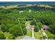 Aerial view of a 2.19 +/- acres lot with home highlighted by approximate lot lines surrounded by forest at 2680 Bay Ridge Dr, Loganville, GA 30052