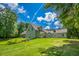 Backyard featuring a well-maintained lawn and a charming exterior at 2680 Bay Ridge Dr, Loganville, GA 30052