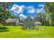 Scenic backyard view featuring lush greenery and a charming exterior at 2680 Bay Ridge Dr, Loganville, GA 30052