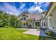 Green two-story home with a well-kept lawn and a grill on the back patio at 2680 Bay Ridge Dr, Loganville, GA 30052