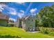 Backyard featuring a well-maintained lawn and a view of the home's exterior at 2680 Bay Ridge Dr, Loganville, GA 30052