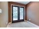 A room with french doors opening to a balcony overlooking the property at 2680 Bay Ridge Dr, Loganville, GA 30052