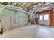 Unfinished basement with concrete walls, exposed insulation and wooden beams at 2680 Bay Ridge Dr, Loganville, GA 30052