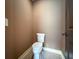 Bathroom with a white toilet, grey tile floor, and neutral paint at 2680 Bay Ridge Dr, Loganville, GA 30052