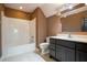 Well-lit bathroom features a bathtub, toilet, modern vanity, and neutral color scheme at 2680 Bay Ridge Dr, Loganville, GA 30052
