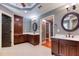Bright bathroom featuring tile flooring, double vanity with framed mirrors, and recessed lighting at 2680 Bay Ridge Dr, Loganville, GA 30052