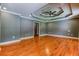 Large bedroom featuring hardwood floors, recessed lighting, tray ceilings, and neutral color paint at 2680 Bay Ridge Dr, Loganville, GA 30052