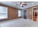 Bedroom featuring neutral carpet, crown molding, and plenty of natural light at 2680 Bay Ridge Dr, Loganville, GA 30052
