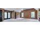 Large bedroom features a ceiling fan, neutral carpet, and access to the outside at 2680 Bay Ridge Dr, Loganville, GA 30052