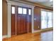 Elegant entryway featuring a solid wood door with sidelights and classic white trim at 2680 Bay Ridge Dr, Loganville, GA 30052