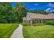 Charming home with a well-manicured lawn, stone accents, and a covered front porch at 2680 Bay Ridge Dr, Loganville, GA 30052