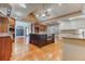 Open kitchen layout with dark wood cabinets, an island, and hardwood floors at 2680 Bay Ridge Dr, Loganville, GA 30052
