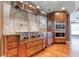 Gourmet kitchen with professional-grade stainless steel cooktop and double ovens at 2680 Bay Ridge Dr, Loganville, GA 30052