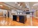 Large kitchen island with stainless steel dishwasher and dark wood cabinets at 2680 Bay Ridge Dr, Loganville, GA 30052