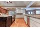 Open kitchen with stainless steel appliances, granite countertops, and hardwood flooring at 2680 Bay Ridge Dr, Loganville, GA 30052