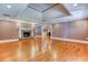 Open-concept living room showcasing a beautiful fireplace and hardwood floors at 2680 Bay Ridge Dr, Loganville, GA 30052