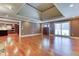 Bright living room with hardwood floors, recessed lighting, and an elegant tray ceiling at 2680 Bay Ridge Dr, Loganville, GA 30052