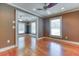 Bright living room featuring hardwood floors, modern ceiling fan, and recessed lighting at 2680 Bay Ridge Dr, Loganville, GA 30052