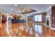 Spacious living area boasts hardwood floors, open layout to the kitchen, and a stone fireplace at 2680 Bay Ridge Dr, Loganville, GA 30052