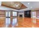 Open-concept living room with a fireplace, custom built-ins, and access to the outside patio at 2680 Bay Ridge Dr, Loganville, GA 30052