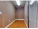 Walk-in closet with hardwood floors, painted walls and a door with partial glass panel at 2680 Bay Ridge Dr, Loganville, GA 30052