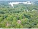 A view from above shows this home nestled among the trees close to the water at 3329 Walt Stephens Rd, Stockbridge, GA 30281