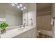 Bathroom with white vanity, quartz countertop, and shower/tub combo at 3329 Walt Stephens Rd, Stockbridge, GA 30281