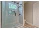 Bathroom with a glass shower featuring stone tile and rain shower head at 3329 Walt Stephens Rd, Stockbridge, GA 30281
