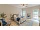 Comfortable bedroom with a full-sized bed, ceiling fan, and an outside deck at 3329 Walt Stephens Rd, Stockbridge, GA 30281