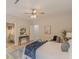 Spacious bedroom featuring neutral walls, ceiling fan, and a small console table at 3329 Walt Stephens Rd, Stockbridge, GA 30281