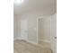 Bedroom showcasing modern floors, neutral walls, and white doors with chrome hardware at 3329 Walt Stephens Rd, Stockbridge, GA 30281
