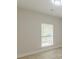 Bedroom with wood-look laminate flooring and window with blinds at 3329 Walt Stephens Rd, Stockbridge, GA 30281