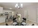 Open dining area connecting seamlessly with a modern kitchen and island seating at 3329 Walt Stephens Rd, Stockbridge, GA 30281