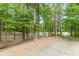 View of the long driveway leading up to this beautiful property with mature trees at 3329 Walt Stephens Rd, Stockbridge, GA 30281