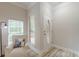 Bright entryway with a decorative glass door, stylish flooring, and a cozy armchair at 3329 Walt Stephens Rd, Stockbridge, GA 30281