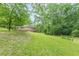 Charming house featuring a lawn and wooden deck in a lush, green, heavily-wooded setting at 3329 Walt Stephens Rd, Stockbridge, GA 30281