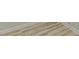 Close up of light wood-look laminate flooring with white trim at 3329 Walt Stephens Rd, Stockbridge, GA 30281
