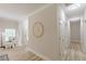 Hallway leads to a bedroom, showcasing wood-look flooring, neutral paint, and decorative details at 3329 Walt Stephens Rd, Stockbridge, GA 30281