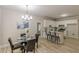 The open-concept kitchen has white cabinets, modern appliances, and is adjacent to the dining area at 3329 Walt Stephens Rd, Stockbridge, GA 30281