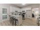 Bright, open kitchen features stainless appliances, eat-in island, and access to the back yard at 3329 Walt Stephens Rd, Stockbridge, GA 30281