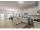 Bright eat-in kitchen with white cabinetry, stainless appliances, and modern countertops at 3329 Walt Stephens Rd, Stockbridge, GA 30281
