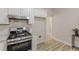 Kitchen featuring a stainless steel gas range and ample counter space at 3329 Walt Stephens Rd, Stockbridge, GA 30281