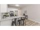 Modern kitchen with eat-in island and stainless steel appliances at 3329 Walt Stephens Rd, Stockbridge, GA 30281