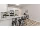 Modern kitchen with a large island, stainless steel appliances, and hardwood flooring at 3329 Walt Stephens Rd, Stockbridge, GA 30281