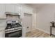 Modern kitchen with stainless steel appliances, gas cooktop, and white subway tile backsplash at 3329 Walt Stephens Rd, Stockbridge, GA 30281
