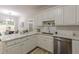 Kitchen with white cabinetry, stainless appliances, modern countertops, and eat-in dining area at 3329 Walt Stephens Rd, Stockbridge, GA 30281