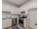 Well-equipped kitchen with white cabinets, stainless steel appliances, and a bright ambiance at 3329 Walt Stephens Rd, Stockbridge, GA 30281