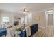 Spacious living room featuring a fireplace, large windows, and stylish, updated flooring at 3329 Walt Stephens Rd, Stockbridge, GA 30281