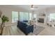 Beautifully staged living room featuring a cozy fireplace and plenty of natural light at 3329 Walt Stephens Rd, Stockbridge, GA 30281